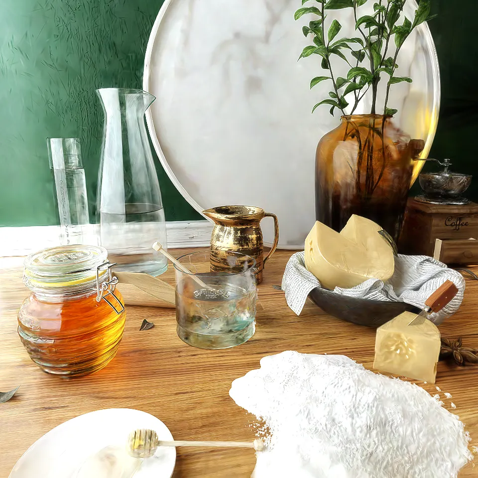 Cannelle et Fromage: glass vessels, honey and cheese in a sunlit interior